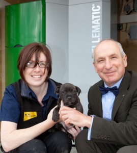 Rachel Wright, assistant manager at the Roden centre, with six week old puppy Tom and  Andy Boroughs, managing director of Organic Energy at the official handover of the renewable heating system