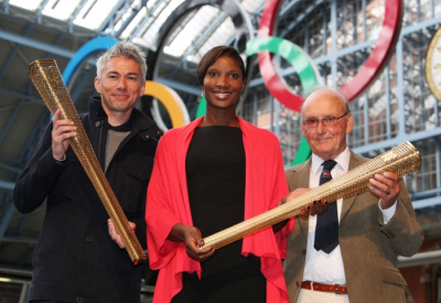 Jonathan Edwards, Olympian Denise Lewis and Austin Playfoot, a Torchbearer from the 1948 Olympic Torch Relay, showcase the London 2012 Olympic Torch to be carried by 8,000 inspirational Torchbearers.