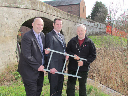 Pictured at the historic Wappenshall Wharf site with a sample section of FSP-manufactured 'escape ladder' are (left to right) FSP sales manager and canal Trustee, John Tudor, FSP managing director, Richard Hilton, and SNCT chairman, Bernie Jones.
