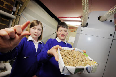 Gabriella White and Matthew Green both 11 with wood pellets used to power the Stadhampton boiler.