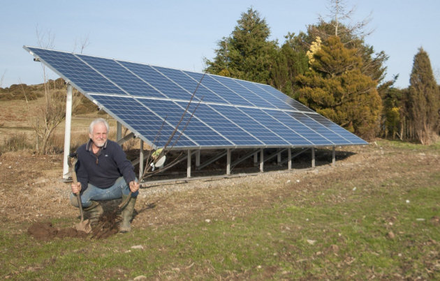 Alistair Forrest, with the solar PV installation in the grounds at Jinlye.