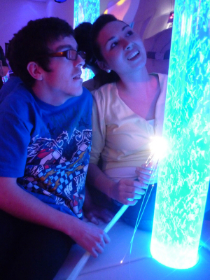Hannah Oliver introduces resident Ben Corran Williams to the new sensory room.