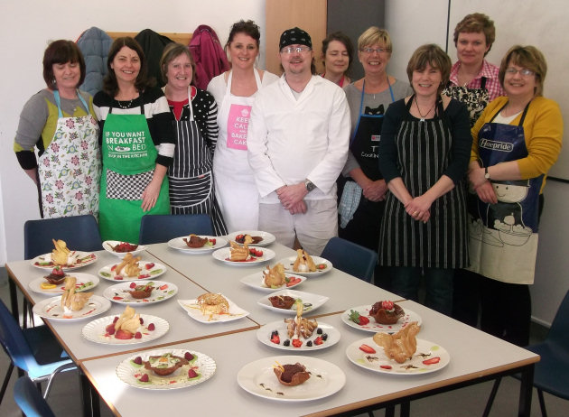 Students with Darren, centre, in the kitchen at the Oswestry Campus. Students with Darren, centre, in the kitchen at the Oswestry Campus.