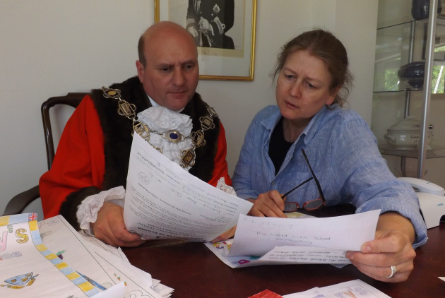 Mayor of Shrewsbury, Cllr Jon Tandy, with Deputy Mayor Beverley Baker judge the posters.