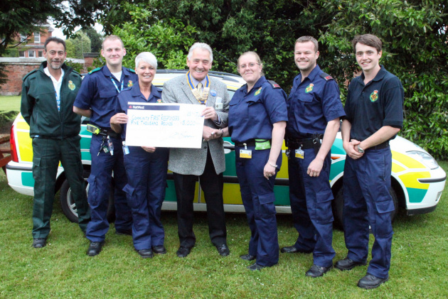 President George Brown presenting the cheque to (from the left) Gerry Evans (North Shropshire CFR scheme co-ordinator), Nick Lovatt (CFR), Lynne Stokes (CFR), George Brown (outgoing President of the Rotary Club of Whitchurch), Kelly Wood (CFR), David Ladd (CFR) and Simon Davies (CFR).