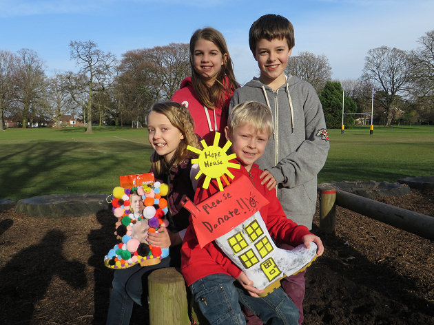 Daisy Phillips and Thomas Tarlton who are members of the Prestfelde School charity committee with (front) Harriet Baker and Toby Jagger who were the winners of the welly decorating competition.