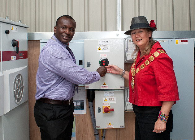 Mayor of Shrewsbury, Councillor Beverley Baker, opens the renewably-fuelled energy centre at The Shrewsbury Club with a helping hand from general manager Richard Attah-Donker.