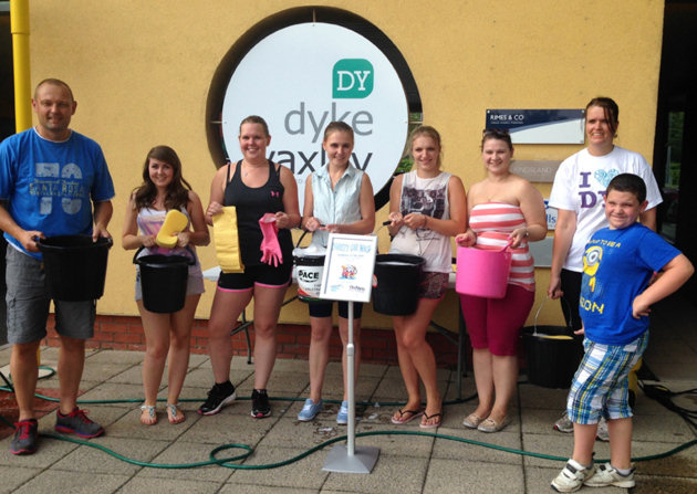 At the charity car wash are, from left, Dave Williams (Henshalls), Hannah Brathwaite, Steph Wright, Sarah Howells, Rhian Harding, Hayley Price and Heike Mallinson (all from Dyke Yaxley) with William Selley.