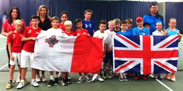 Young tennis players and coaches from The Shrewsbury Club and their visitors from Malta show off their nation's flags ahead of their Davis Cup style challenge match. 