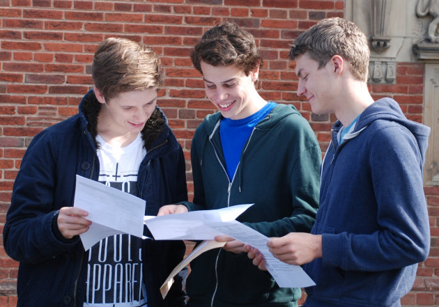 Harry Fox, James Warburg and Toby Lansdell check their results at Shrewsbury School.
