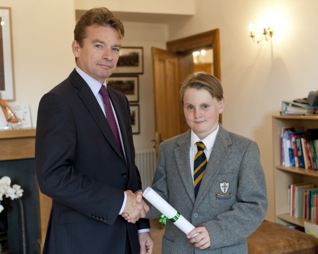 Mark Groome, headmaster of Prestfelde, presenting Patrick with his award