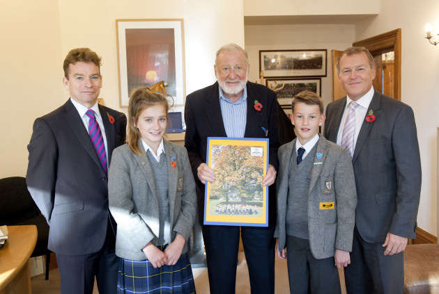 Prestfelde headmaster Mark Groome, head girl Ella Davies, benefactor David Blackburn OBE, head boy Tommy Price and school governor Matt Sandford. Mr Blackburn is holding a thank you card signed by every child in the school