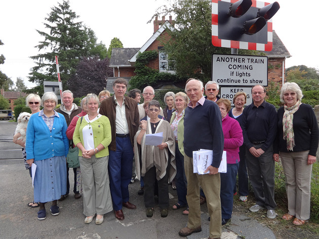 MP Philip Dunne with local residents of Ashford Bowdler at the Level Crossing