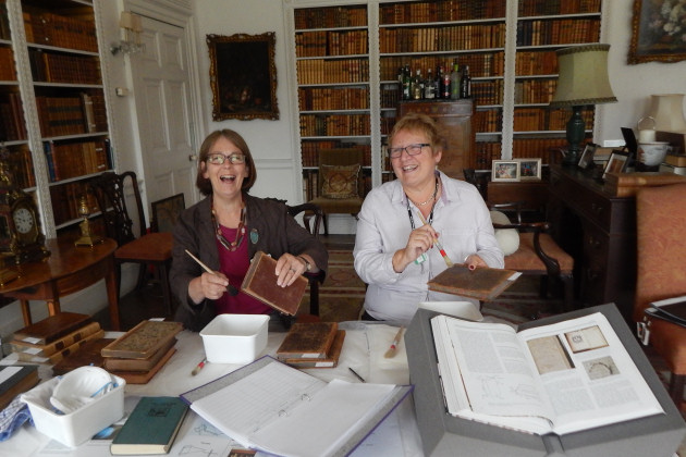 Book Conservation volunteers Angela Webb and Chris Keys at work in the Library at Dudmaston