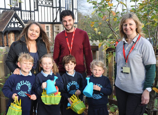 Pupils Sam Spiby, Willa Bowett, Thomas Pryce and Charlotte Owen with Head of Pre-Prep Suzanne Wakeley and visitors from the RHS