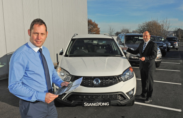 Stuart Woolley with colleague Barrie Christopher and the new SsangYong range of vehicles