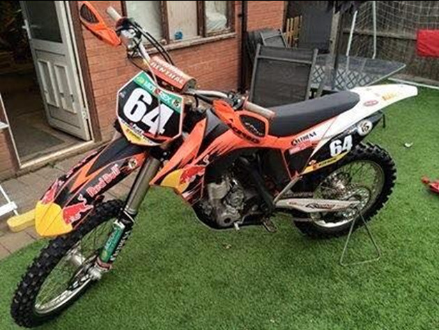 One of the motorcross bikes, orange in colour and made in 2012