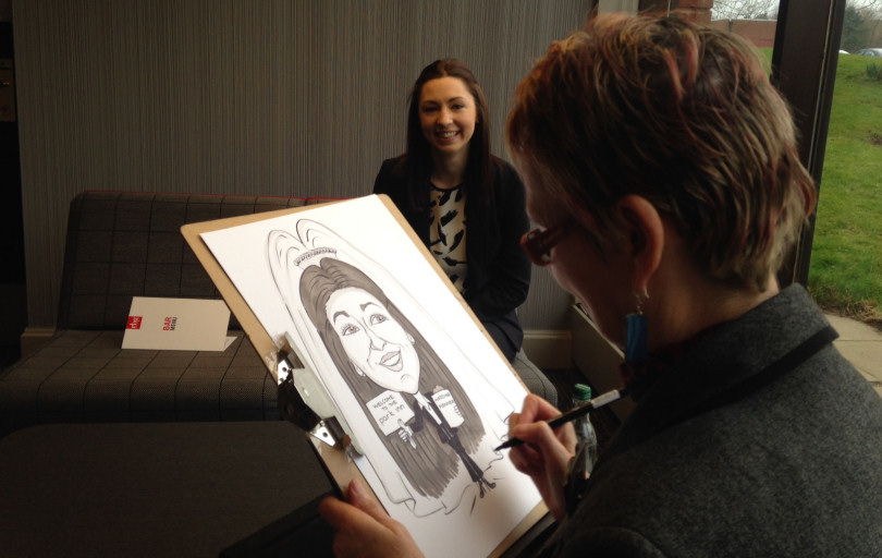Caricaturist, Chris Ryder, and Rebecca Dawson of the Park Inn