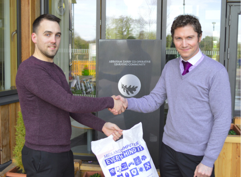 Richard Moore at the Woodlands Primary & Nursery School taking delivery of hardware from Mike Haycox of Midland Computers