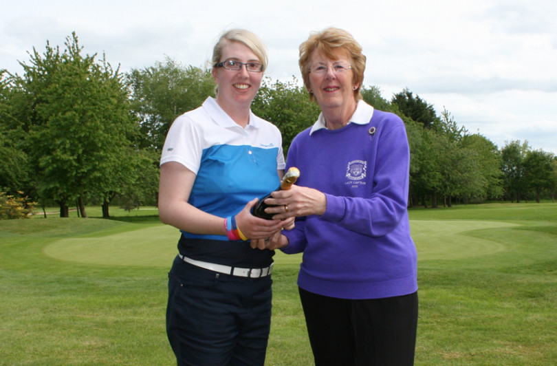 Shrewsbury Golf Club Lady Captain, Tina Robinson presents Katrina Gillum with Champagne