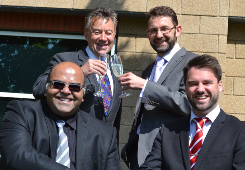Back, from left, Martin-Kaye’s Graham Davies and Andrew Oranjuik, and front, from left, Mohammed Ahsan and Jason Round celebrate their latest award