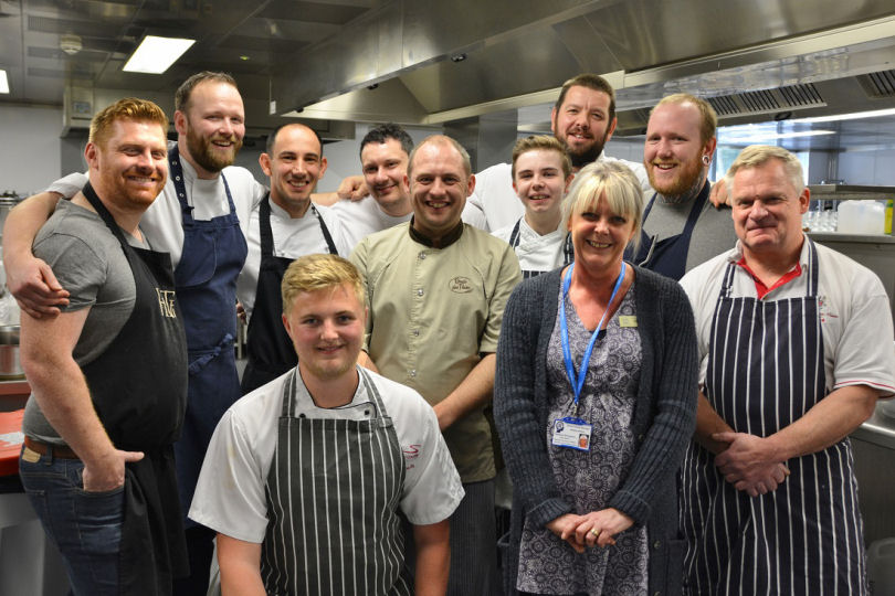 James Sherwin from Henry Tudor House, Karl Martin from Old Downton Lodge, Gennaro Adaggio from La Dolce Vita, Andrew Birch from Fishmore Hall, Rob Swift from Swifts Bakery, Level 3 Catering student Chris Taylor, Chef Lecturer Dan Gibbons, Josh Donachie from Henry Tudor House and Michel Nijsten from the Albright Hussey Manor Hotel. Front row: Level 3 Catering Chef Matt Wadsworth and Debbie Wilcox, Headway Centre Rehab Manager