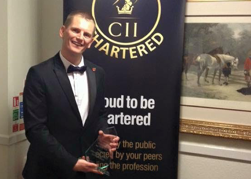 Daniel Butler, of Beaumont Lawrence, with his award