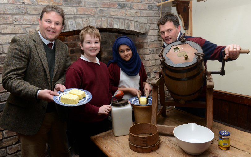 Paul Madeley, of Madeleys Chartered Surveyors, with farmer Derek Harper and youngsters from the Millbrook School in Leegomery
