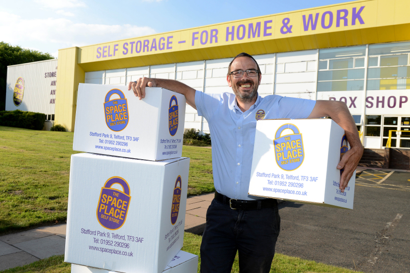 Ian Freeman with some of the boxes being donated to Telford Food Bank