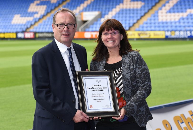 Kirsty Smallman receives the Support to Caradoc award from business manager Peter Masters