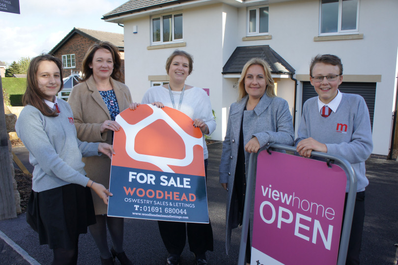 Eva Nikolova of The Marches School Eco Committee , Kate Howell owner of Woodhead Oswestry Sales and Lettings, Jo White Business Development Manager at The Marches School, Lorraine Hopkins Marketing & PR Manager at Tesni Homes, Niall Dennehy of The Marches School Eco Committee.  All standing outside Tesni’s new view home on Morda Road