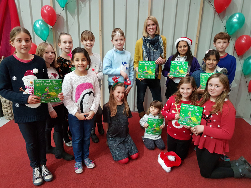 Author Lorna McCann from Newport with children from St Mary's Primary School in Shawbury at the Alan Ward Charity Christmas Market