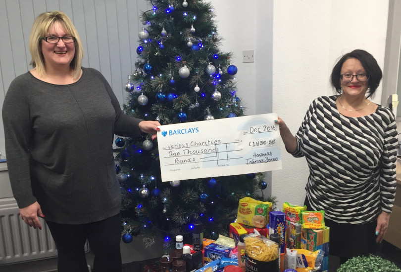Nina Evans and Elsa Mackay from Henshalls with the charity donations