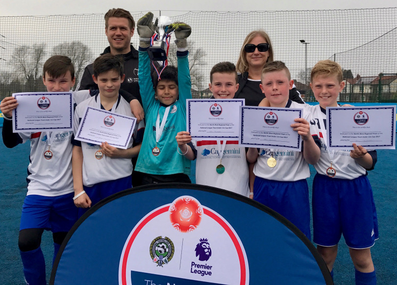 The delighted Lawley Primary School footballers celebrate reaching Wembley with coach Kevin Sandwith and Year 6 teacher Kate Roberts