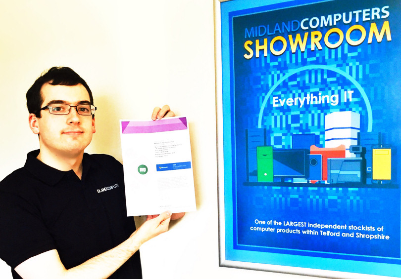 David Cheese with a certificate showing Midland Computers is a Microsoft Authorized Education Partner