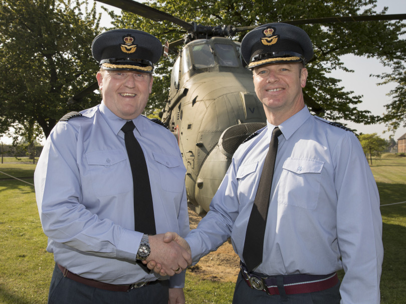 The outgoing Station Commander Group Capt Jason Appleton (right) hands over command to Group Captain Chuck Norris