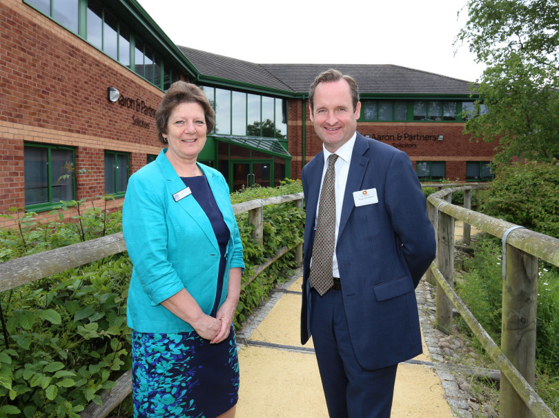Julia Baron with Hugh Strickland outside Aaron & Partners’ Shrewsbury office