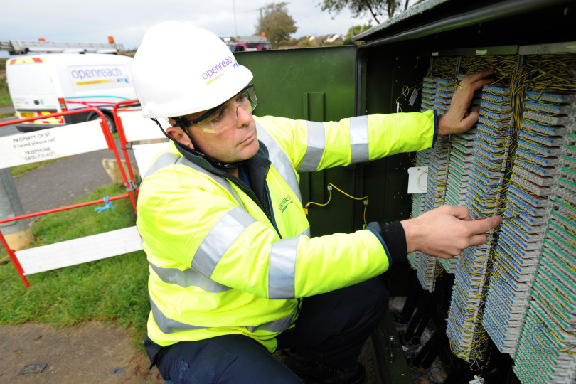 An Openreach engineer working at a fibre broadband cabinet