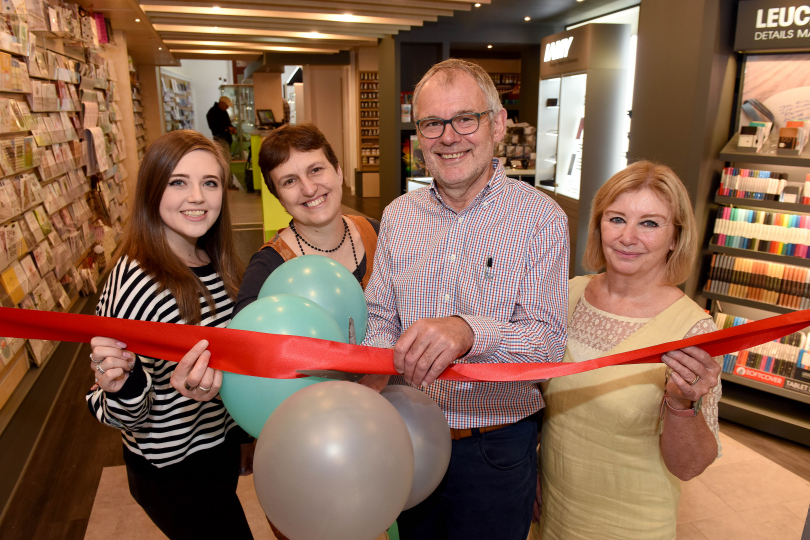 Write Here staff celebrating the re-opening, from left, Caitlin Duncan, Hilary Hannaford, John Hall and Denise Stoke