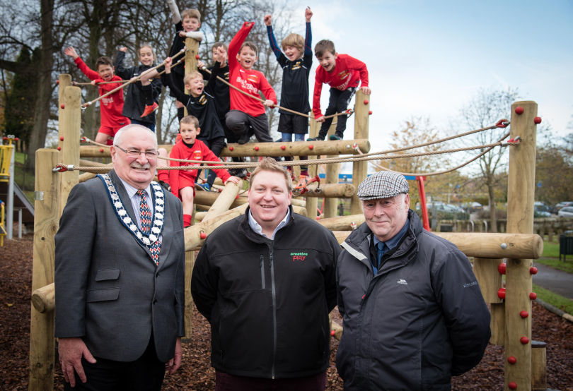Pictured from left; Mayor of Whitchurch Tony Neville, Creative Play Sales Director David Esser and Cllr Terry O'Neill with the Whitchurch Alport Junior FC team