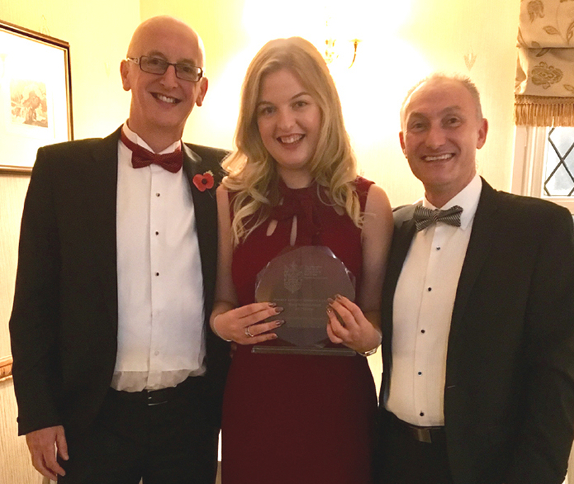 Henshalls Directors Mark Freeman (left) and Martin Pitchford with Lucy Sutton and her Young Achiever of the Year award