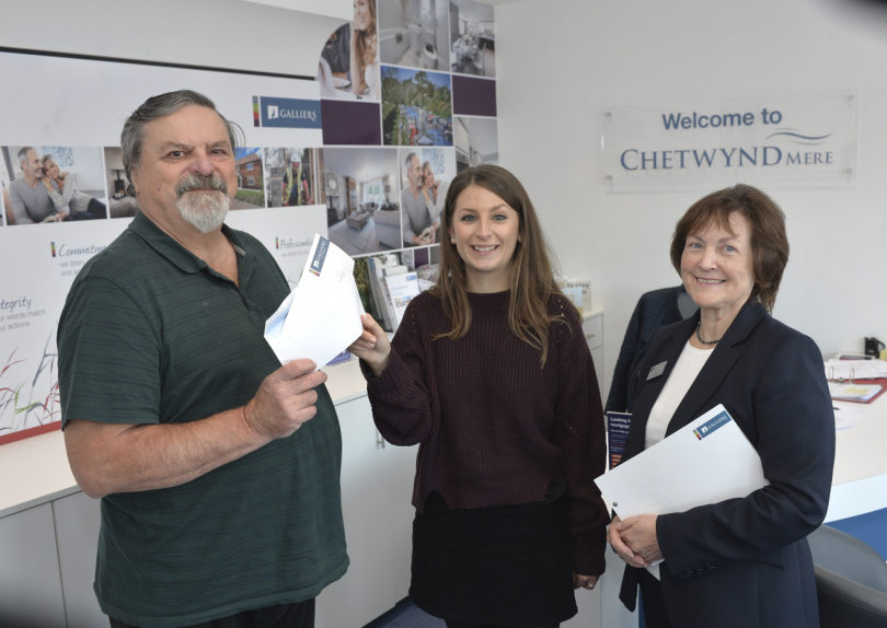 From left, councillor Maurice Jones receives the cheque from Sonya Bagley and Sue Donaghy of Galliers Homes at the Chetwynd Mere development