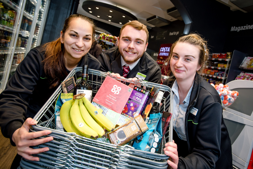 Midcounties Co-operative Food colleagues Roxanne Cercel, Karl Shellam and Sam Chesters with some of the Fairtrade products available at the Midcounties Co-operative Food