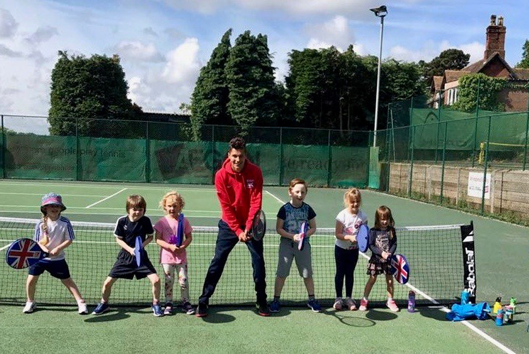 Coach Ollie Gwilt with youngsters at a Tennis for Kids course at Lilleshall Tennis Club