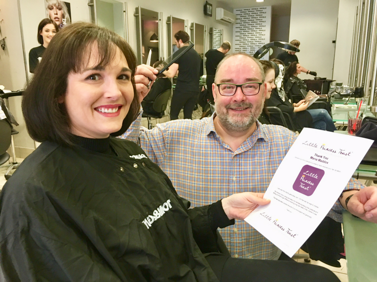 Pictured, Shrewsbury dental nurse Maria Maddox, who had over 12 inches of hair cut off for the charity, with Gavin Pulham of Toni & Guy