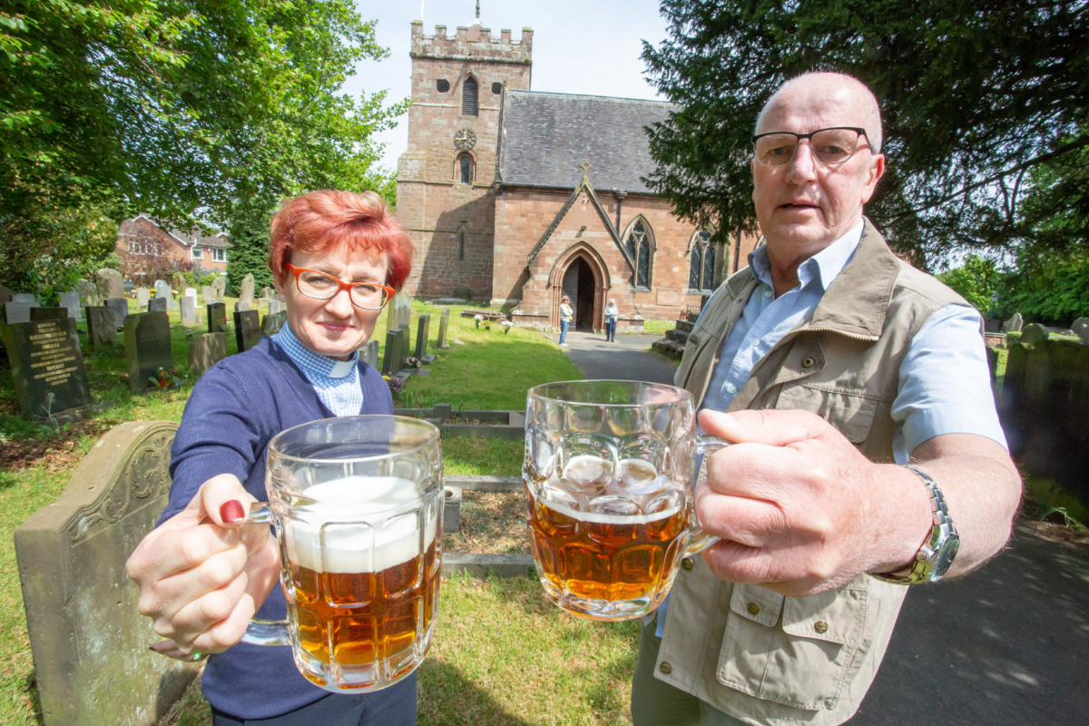 Mary Thomas, Vicar at St Mary Magdalene and Frank Aston, one of the volunteers, get ready for this weekend's Beer Festival