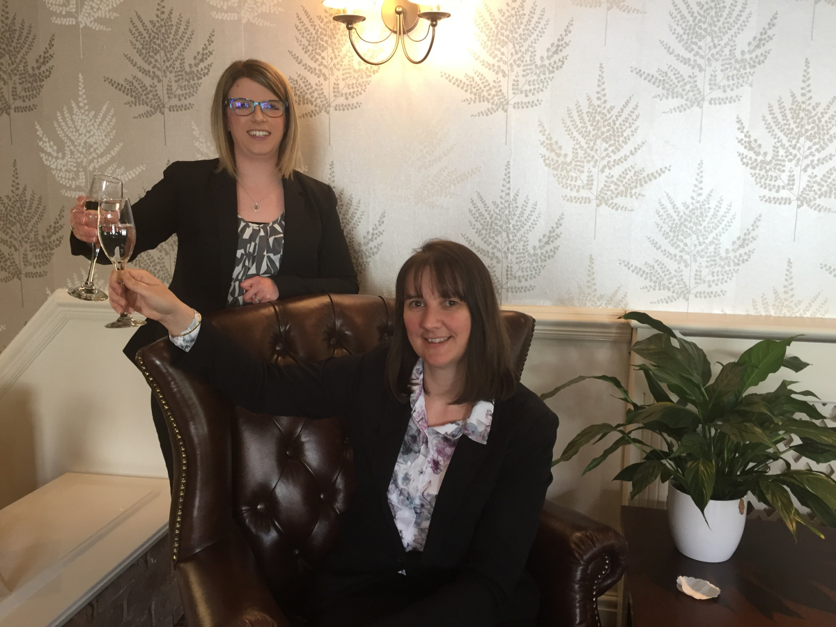 Melissa Jordon, receptionist, celebrates the new reception with Best Western Valley Hotel general manager Jo Boddison