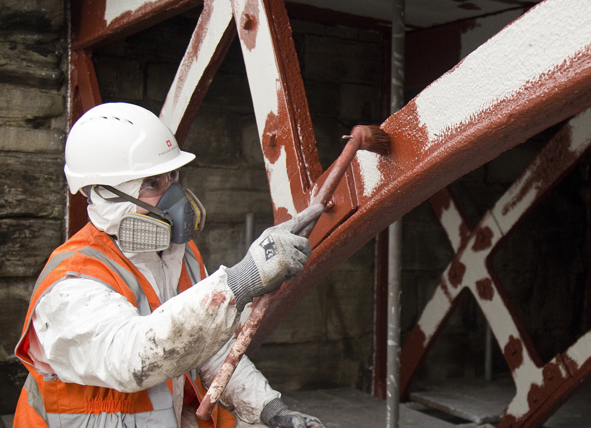 A team of six painters are painting the bridge using 2,400 litres of paint, which will protect the historic ironwork in a similar way to the paint system used on the Forth Bridge. Photo: English Heritage