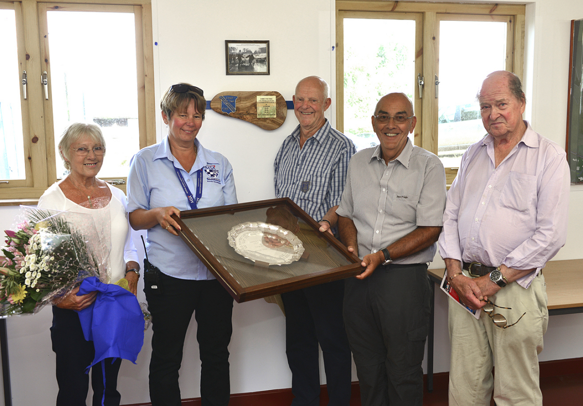 Unveiling the commemorative plaque and holding the presidents salver, are from left, Pauline Trimble, Annie Goodyear, past president Garth Weaver, club chairman Steve Layton and Sir Michael Leighton