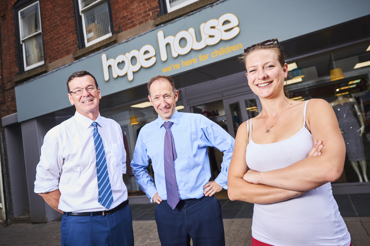 Richard Connolly and Peter Stephen from mfg Solicitors with Emily Jones from Hope House